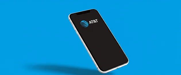 A smartphone displaying the AT&T logo on a blue background