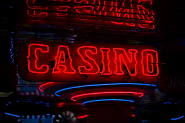 Club One comp dollars class action settlement — downtown Las Vegas casino neon sign