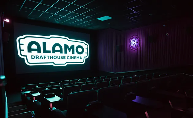 Rows of empty seats in a darkened movie theater auditorium